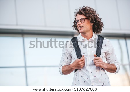 Similar – Foto Bild Männlicher Rucksacktourist in den Bergen am sonnigen Tag stehend