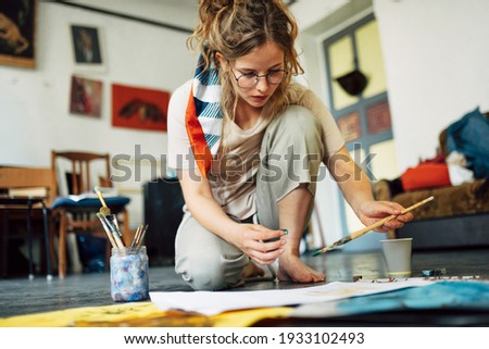 Similar – Image, Stock Photo Beautiful happy craft woman wearing apron looking at camera and smiling while standing in her art studio or craft pottery shop