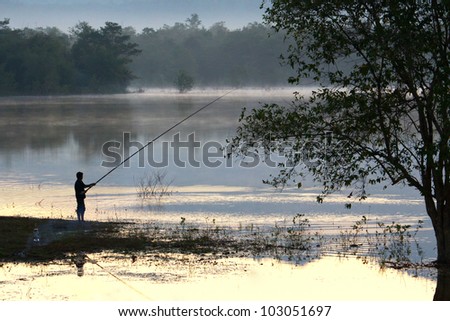 Fish-man fishing on the lake, Thailand