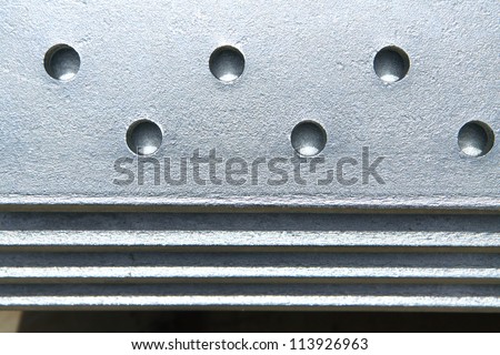 Hot-dip galvanized steel texture pattern, rack steel angle edges.