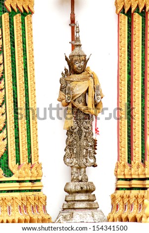 Angel statue standing for the curator of temple, Thailand