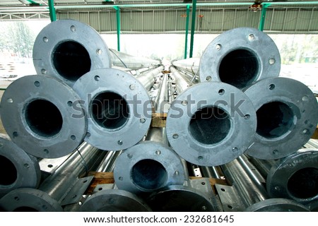 Hot-dip galvanized steel structure bunch on the rack in warehouse before shipment