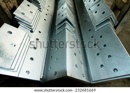 Hot-dip galvanized steel structure bunch on the rack in warehouse before shipment