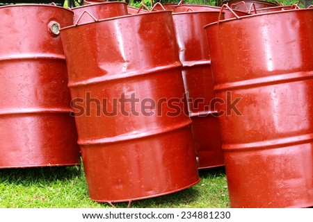 Stack of old red barrel or oil-drums