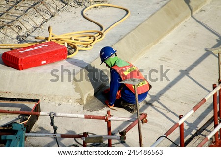 NONTHABURI-THAILAND -SEPTEMBER 20 : The worker for construction concrete bridge over the river at worksite on September 20, 2014, in Nonthaburi, Thailand