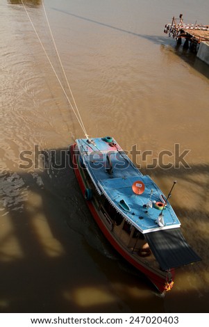 NONTHABURI-THAILAND-SEPTEMBER 20 : Boats carrying sand in Chaophraya river under-construction of its deep long pile foundation on September 20, 2014 in Nonthaburi, Thailand