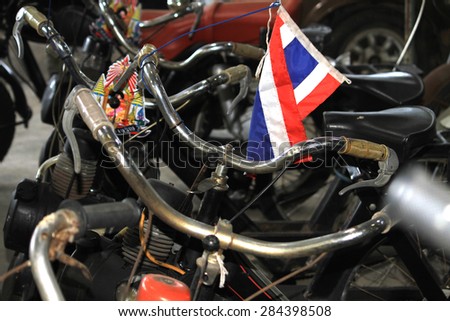 NAHKONPHATHOM-THAILAND-OCTOBER 11 : A part of the old vintage motorcycle shown in Jessada Museum on October 11, 2014, Nakonphathom Province, Thailand.