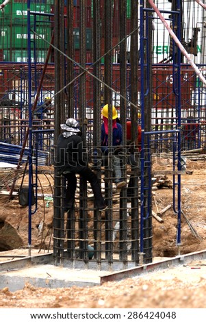 BANGKOK-THAILAND-NOVEMBER 4 : Worker construction the concrete bridge on the way on November 4,2014, Bangkok Thailand.