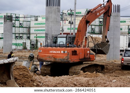 BANGKOK-THAILAND-NOVEMBER 4 : Worker & loader construction the concrete bridge on the way on November 4,2014, Bangkok Thailand.