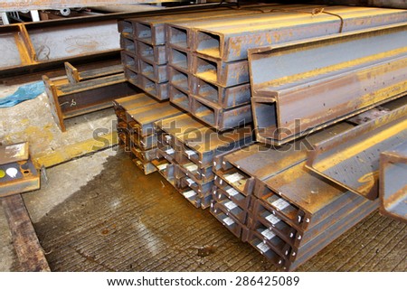 Rusty steel structure bunch on the rack in warehouse for raw material