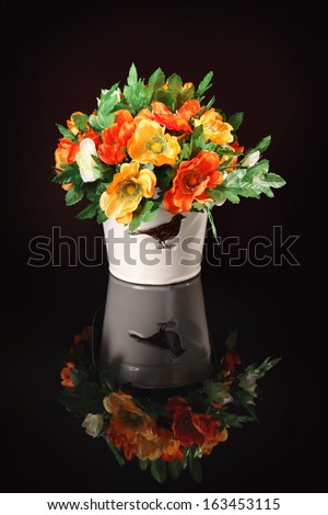 bouquet of artificial flowers isolated on a black background