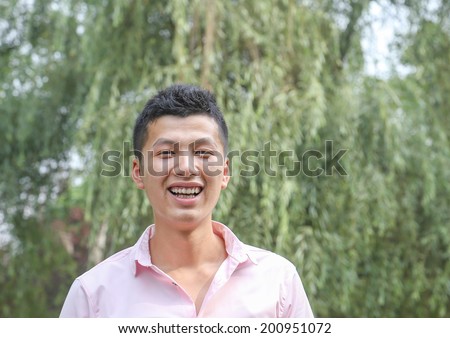 young man laugh outdoor
