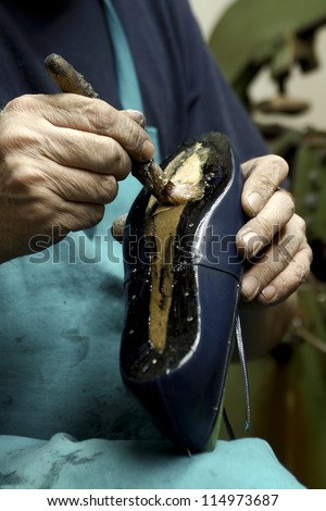 Shoemaker Shoemaker working on a new hand made pair of shoes