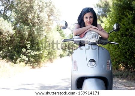 Young female enjoys a motorcycle ride