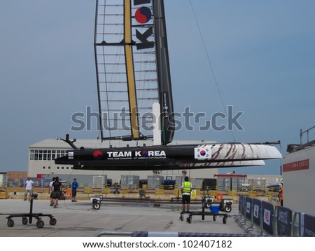 VENICE, ITALY - MAY 11: Team Korea AC45 catamaran in the team bases area is going to be moved in the sea for tests during the America's Cup first races days in May 11, 2012 in Venice, Italy.