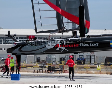 VENICE, ITALY - MAY 11: Artemis Team AC45 catamaran in the team bases area is going to be moved in the sea for tests during the America's Cup first races days in May 11, 2012 in Venice, Italy.