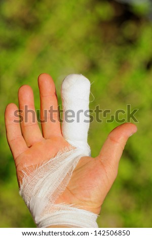 white medicine bandage on injury finger