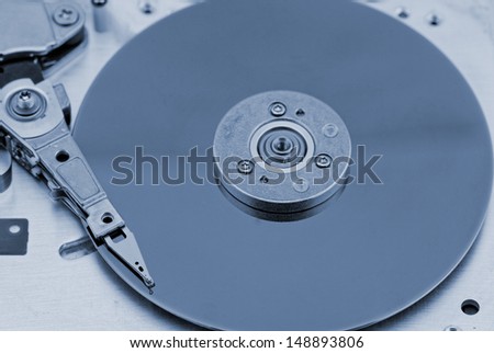 Open computer hard drive on white background with blue (HDD, Winchester)
