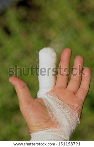 white medicine bandage on injury finger