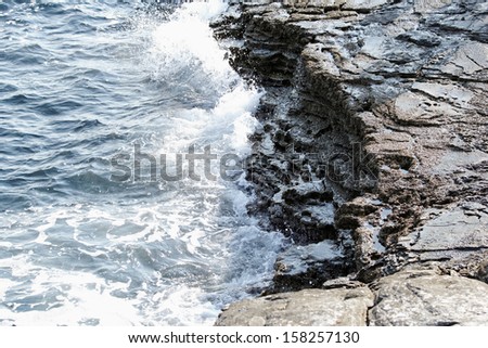 the rocky beach breaks the huge waves