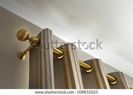 Curtains and gilt metal rod