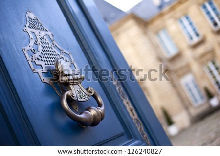 Door of a French mansion, bronze knocker