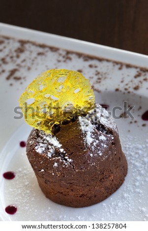 Chocolate cake and lemon candy in a plate
