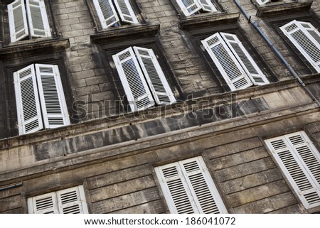 Facade of an old stone building in Bordeaux, France