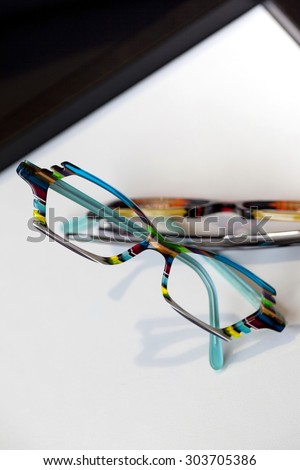 Stylish colorful glasses in an optical shop