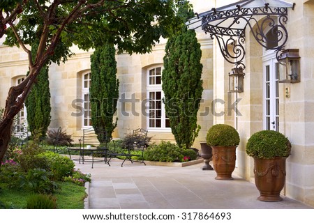 Garden and terrace of a luxury French mansion near Bordeaux