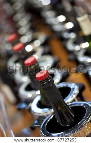 Wine bottles in buckets for wine tasting