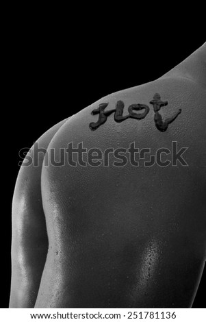 Woman's back with contrast lighting and black background
