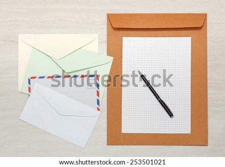 A set of blank envelopes with paper and pen view 2