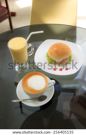 Natural lighting photo of casual breakfast in cafe with shallow DOF