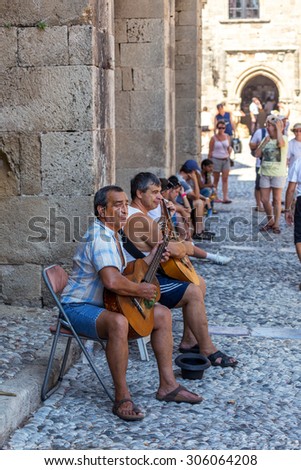 Old streets  Rhodes, Greece, September, 13 2014 -Rhodes streets musicians entertain tourists, 13 September 2014.