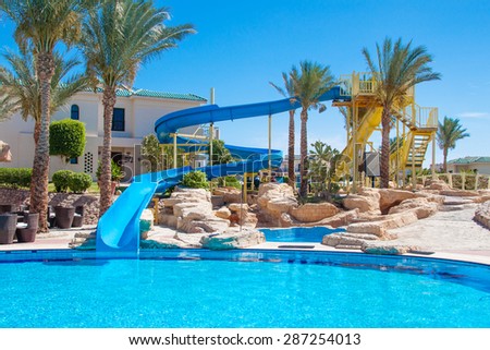 Egyptian hotel | Sharm El Sheikh, Egypt - circa april, 2015: Egyptian hotel resort and spa view with palm trees, swimming pool and blue sky