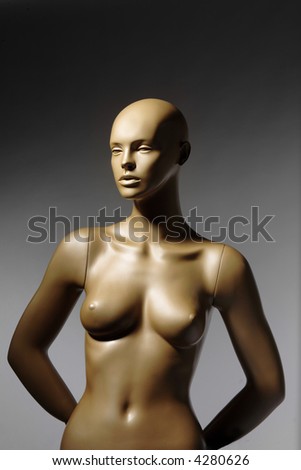 the mannequin standing alone on grey background