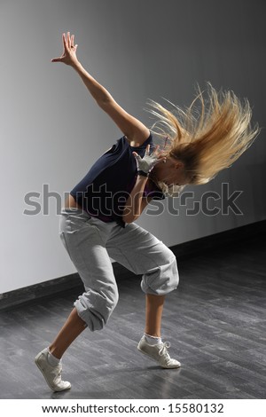 young stylish woman dancing modern dance