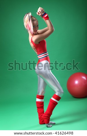 sexy female doing aerobic exercises in sports clothing