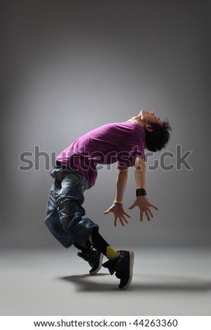 Modern Dancer Poses In Front Of The Studio Background Stock Photo ...