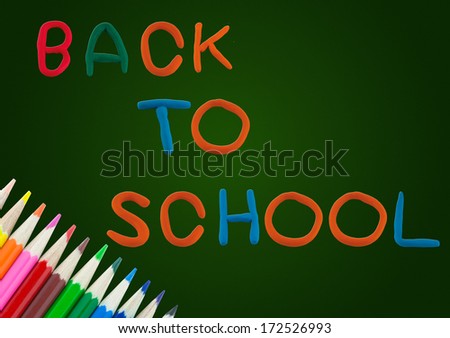 colorful wood pencil color frame border background with back to school on chalk board