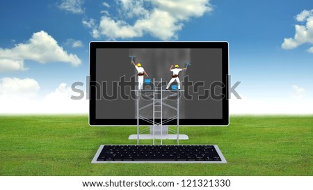 Conceptual image of computer maintenance with engineers cleaning out the dirt on  monitor. With green grass and blue sky background.