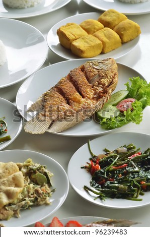 Indonesian fried fish menu served with refreshing healthy tropical vegetables, rice, tofu (soybean curd). This menu usually served for lunch