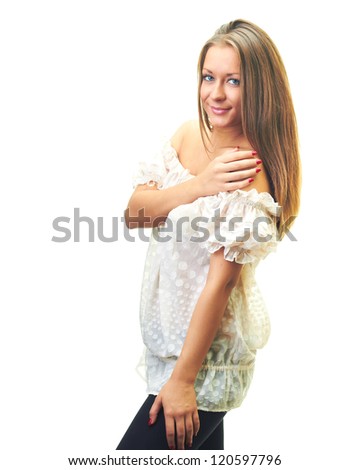 Attractive smiling young woman in a white blouse, put her right hand on her left shoulder. Isolated on white background