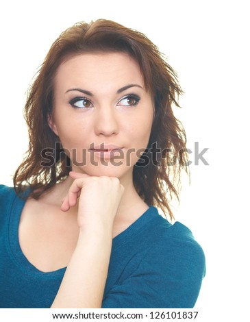 Portrait of attractive young woman in a blue shirt. Woman looking in the upper-left corner. Isolated on white background