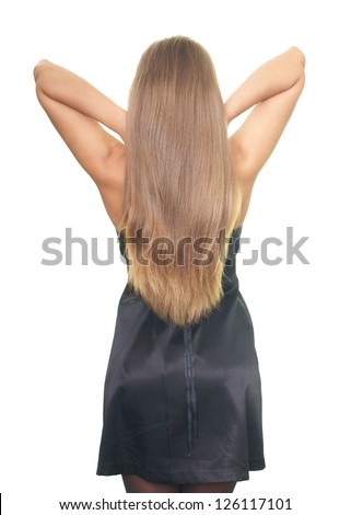Attractive young woman in a black dress stands back. Beautiful long blond straight hair. Isolated on white background