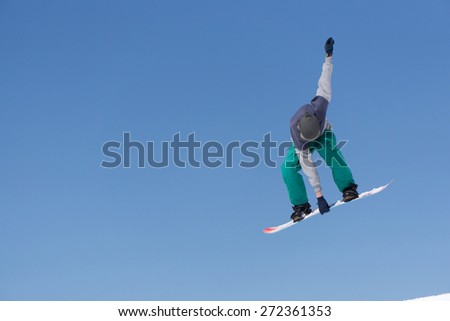 Snowboarder jumps in Snow Park, big air