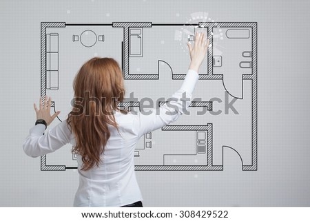 Young woman architect working with a virtual apartment plan