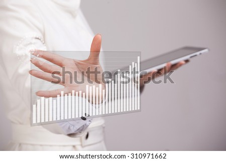 female hand working with interactive graph