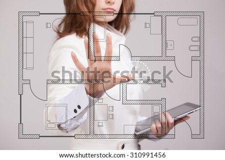 Young woman architect working with a virtual apartment plan